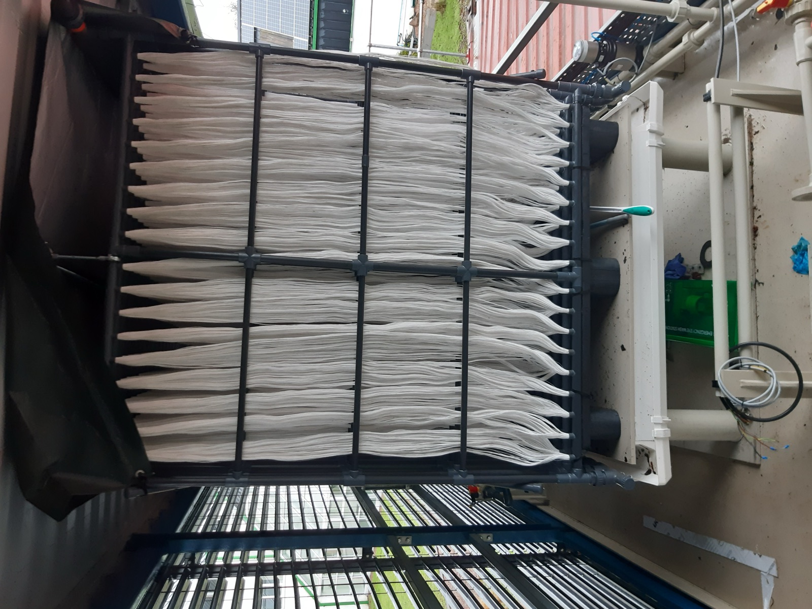 Rack of hollow-fibre membrane modules inside the capture container