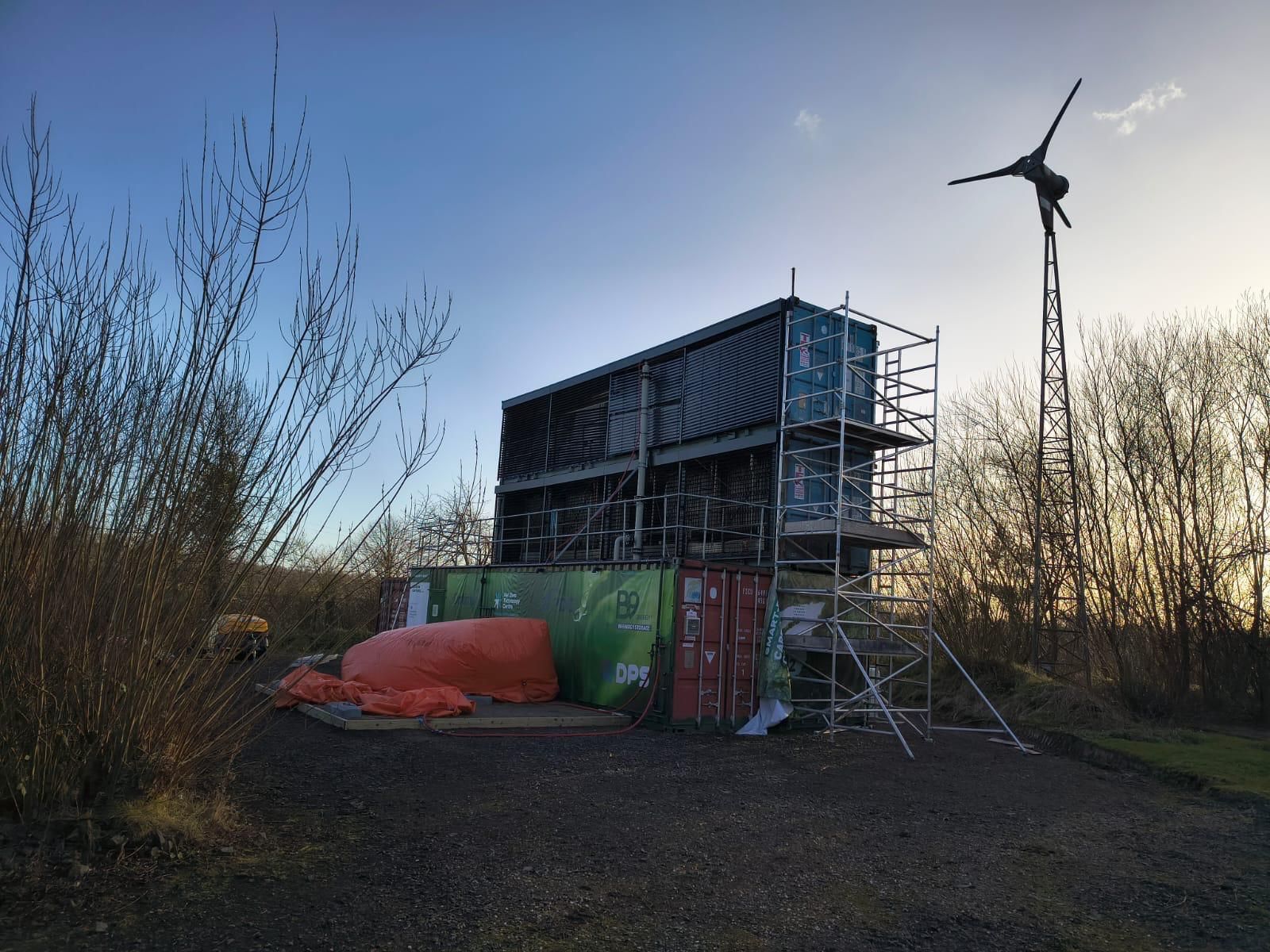 The SMART-DAC pilot plant next to a wind turbine in Northern Ireland